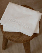 Cloud | The Barrier Towel close up folded on the stool
