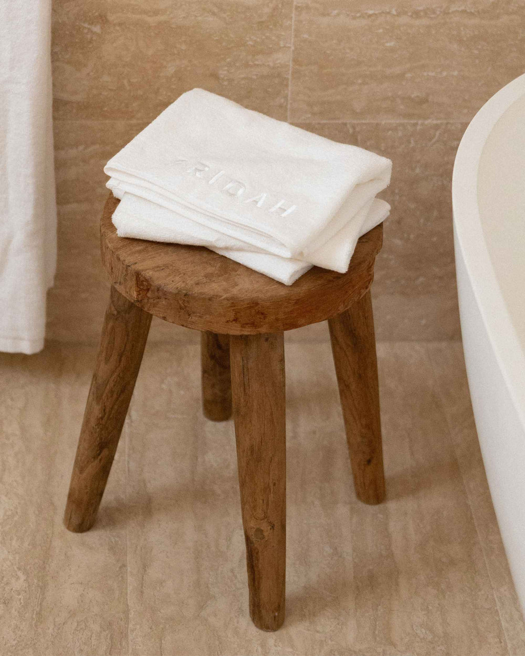 The Barrier Towel folded on the stool