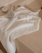 Cloud | The Barrier Towel draped on the vanity