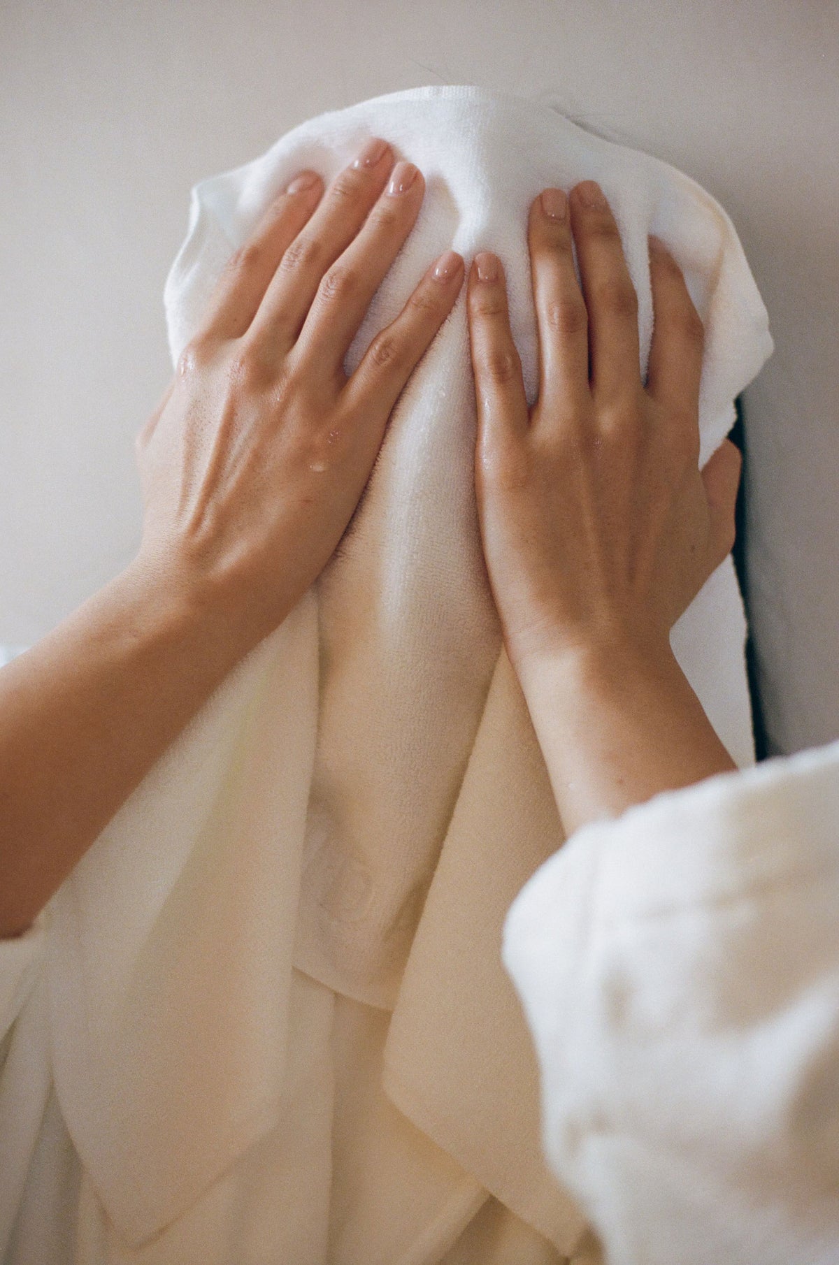 white face towel with Fridah logo