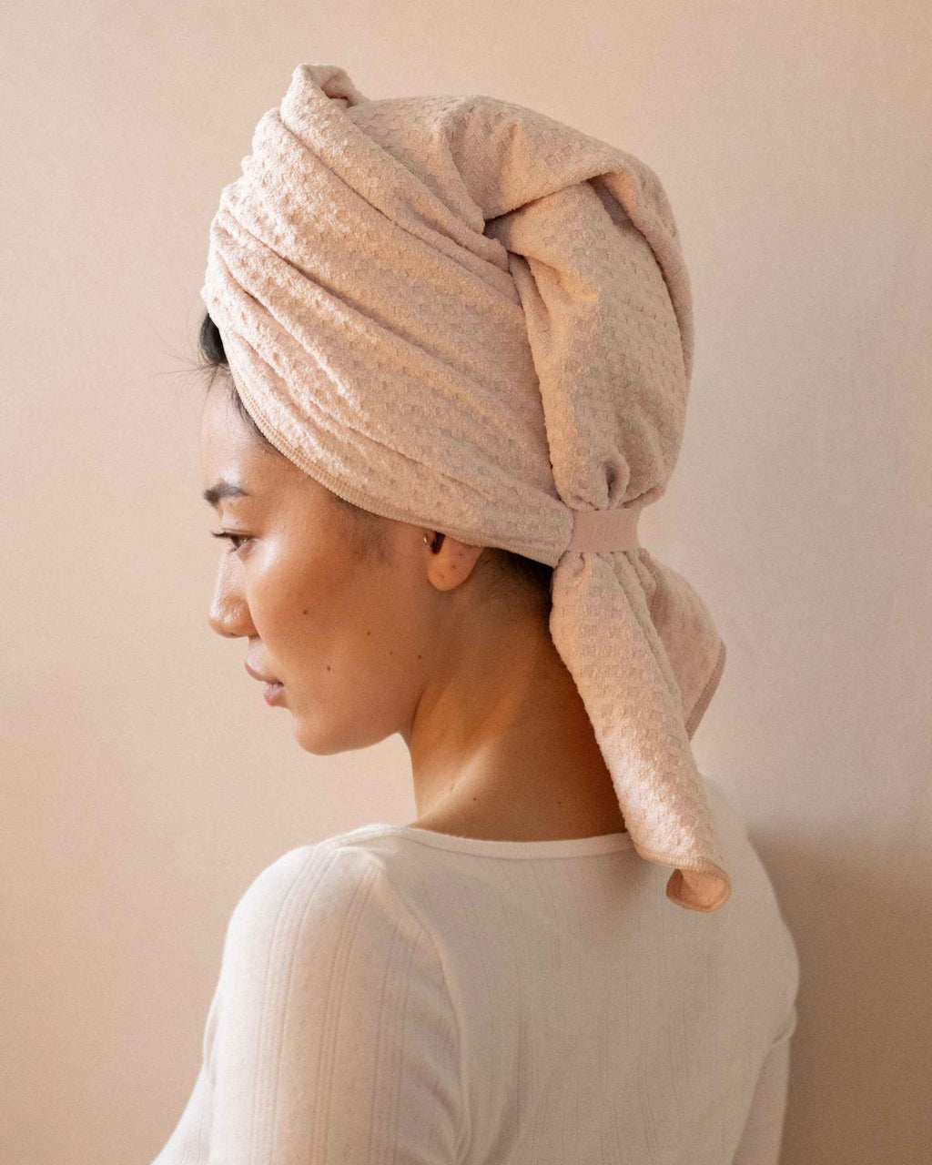 The Repair Wrap tied on damp hair, seen from behind