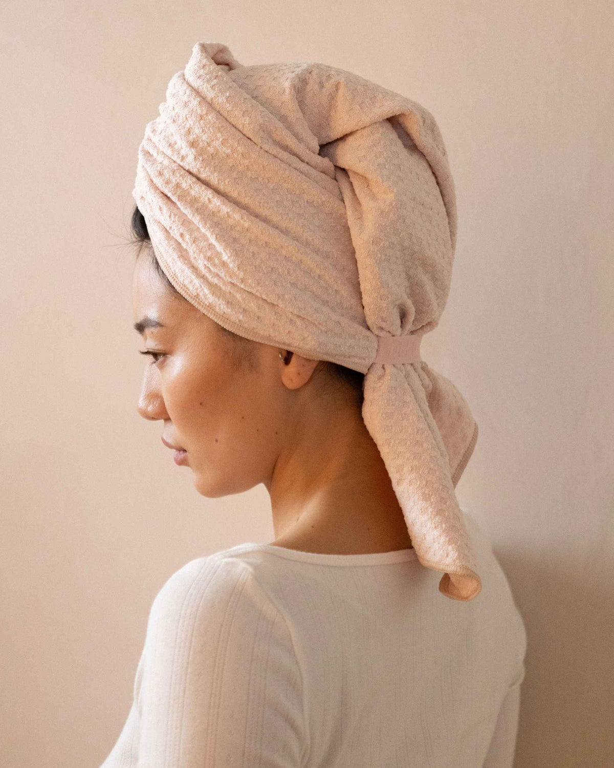The Repair Wrap tied on damp hair, seen from behind