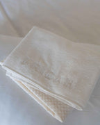 Cloud | The Recovery System folded together, embossed Fridah logo on the towel