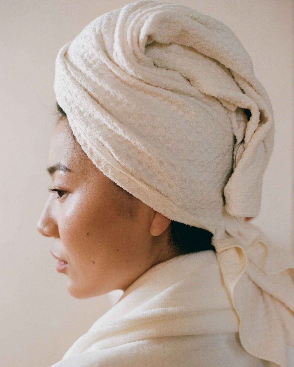 The Repair Wrap tied on damp hair, seen from the side