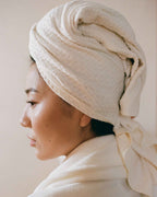 Cloud | The Repair Wrap tied on damp hair, seen from the side