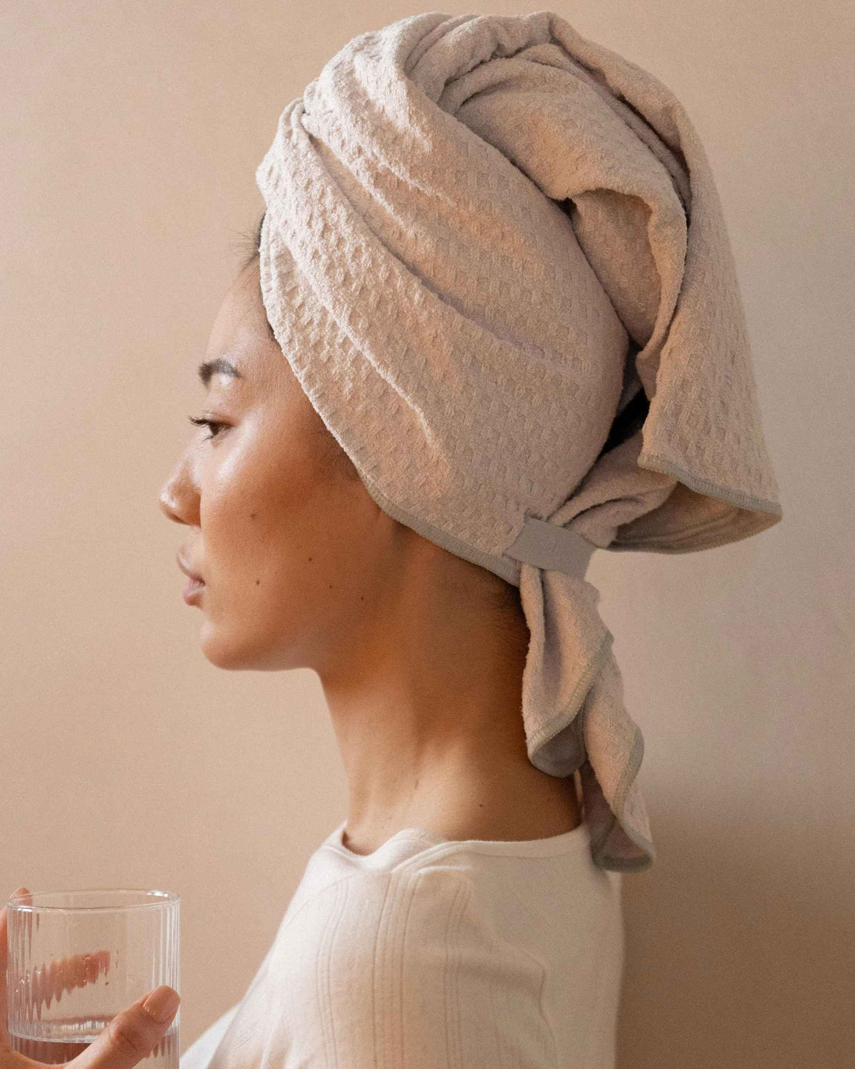 The Repair Wrap tied on damp hair, seen from the side