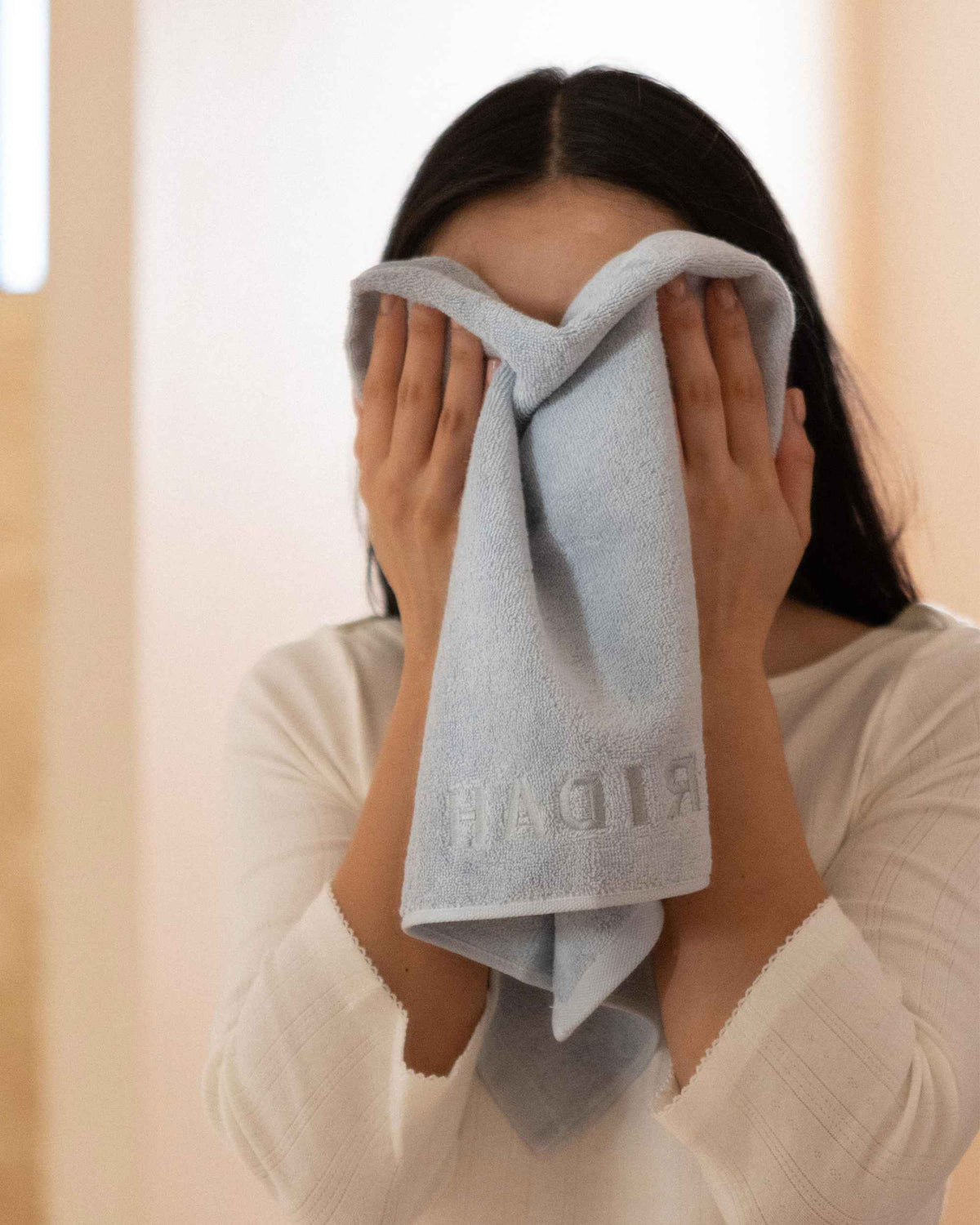 Pressing The Barrier Towel to the face
