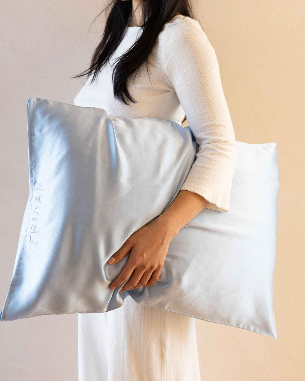 Holding The Restore Case silk pillowcase