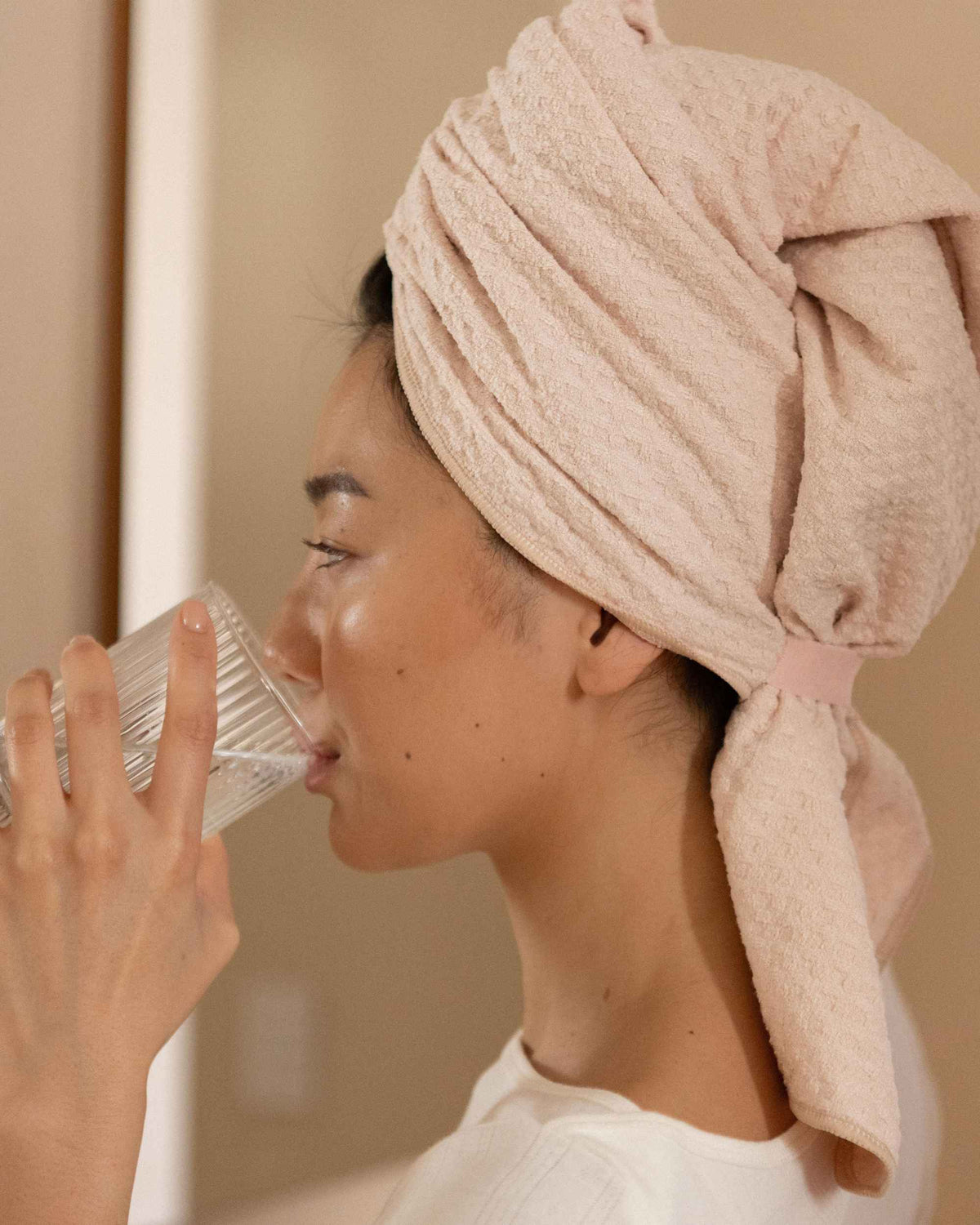 Drinking a glass of water with The Repair Wrap on