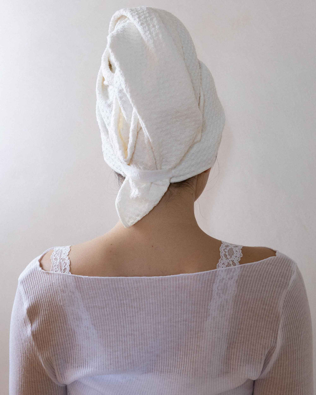 The Repair Wrap seen from behind, tied at the nape