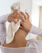 Cloud | Hands fastening The Repair Wrap at the nape