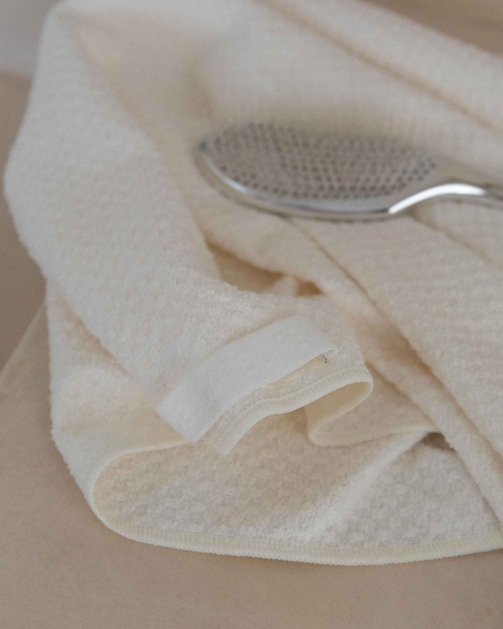 The Repair Wrap folded beside a hairbrush