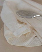Cloud | The Repair Wrap folded beside a hairbrush