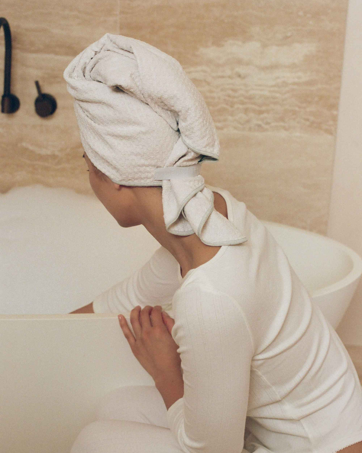 Sitting on the edge of the bath with The Repair Wrap on