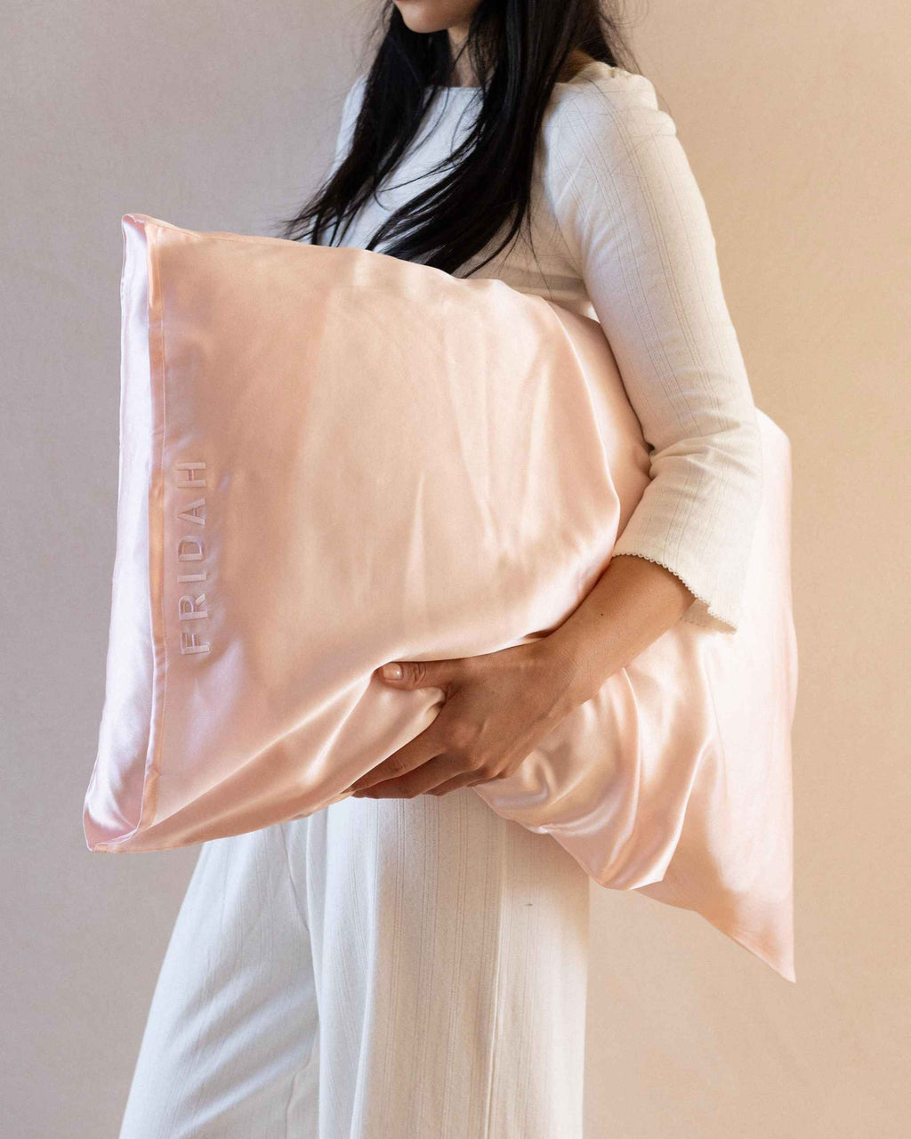 Carrying The Restore Case pillow under one arm