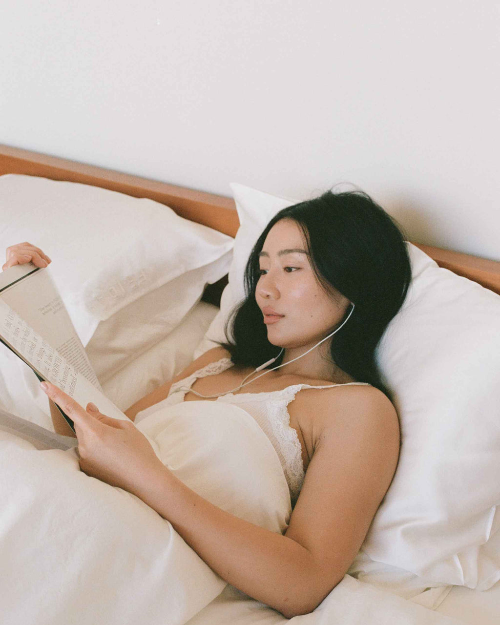 Reading in bed, propped against The Restore Case