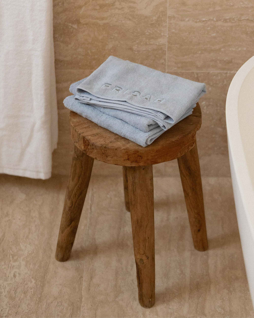 The Barrier Towel folded on the stool