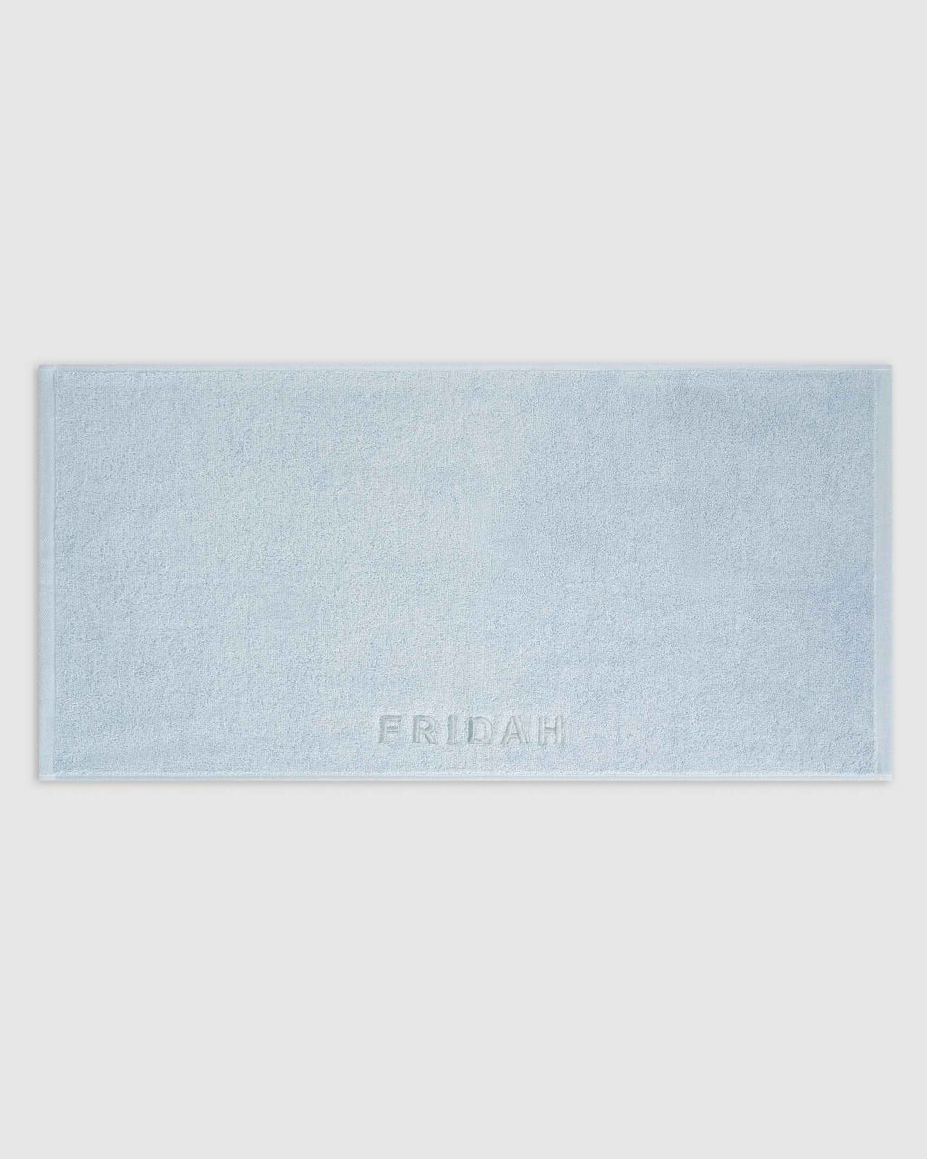 The Barrier Towel laid flat showing the embossed logo